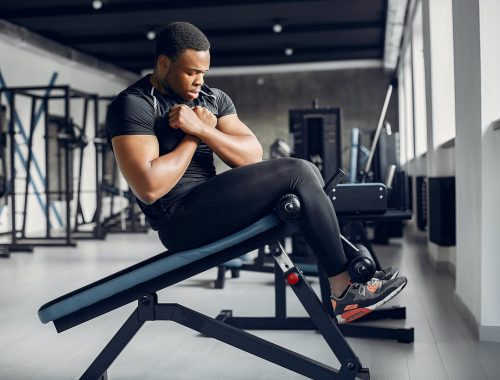 A handsome black man is engaged in a gym